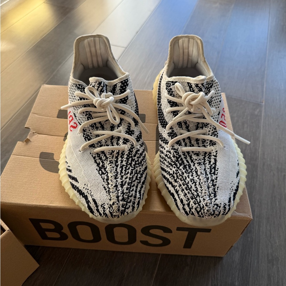 Yeezy Black and White Sneakers with Boost Cushioning